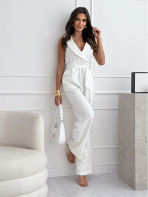Women’s V-neck sleeveless jumpsuit with belt, stylish summer jumpsuit from Hot Trend Vault, featuring a fitted waist and lightweight fabric.