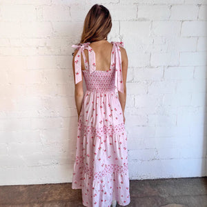 Pink floral printed cake dress for women by Hot Trend Vault, sleeveless with tiered ruffle skirt and feminine floral design.