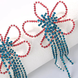 Colorful tassel drop earrings with flower design from Hot Trend Vault, perfect for festival or drag queen jewelry style.