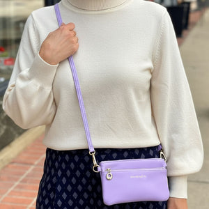 Hot Trend Vault Bella RFID crossbody purse with smartphone access and RFID blocking, shown in a lifestyle setting.
