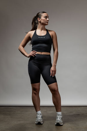Black SOHO women's high rise technical shorts with 8-inch inseam, featuring a sleek fit and athletic design by Hot Trend Vault.
