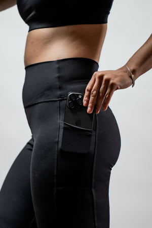 Black women's Soho full-length high waist leggings by Hot Trend Vault, showing the sleek fit and stretchy fabric.