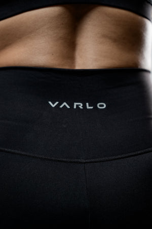 Black women's Soho full-length high waist leggings by Hot Trend Vault, shown on a model with a close-up view of the fabric.