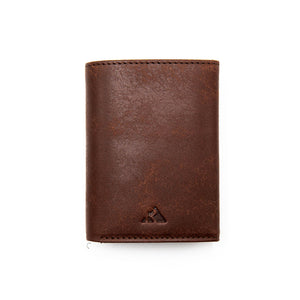 Full-grain vegetable tanned leather wallet with RFID blocking and popup card feature by Hot Trend Vault.