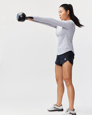 Excel women's workout shorts with camo print from Hot Trend Vault, featuring extra coverage for active sprints, shown from side.