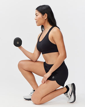Black Excel Women's Workout Shorts from Hot Trend Vault featuring extra coverage for active sprints and comfortable fit.