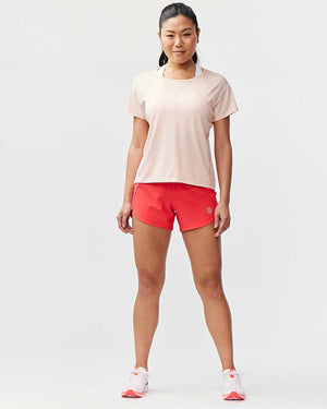 Hot Trend Vault Excel women's workout shorts in hot coral nectar, designed for extra coverage during sprints and exercise.