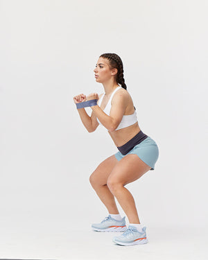 Excel Women's workout shorts with extra coverage for sprinting, shown from the side in mineral color by Hot Trend Vault.