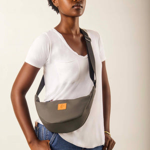 Gray round mini vegan leather shoulder bag with Kenyan fabric lining by Ecodunia, stylish compact crossbody purse.