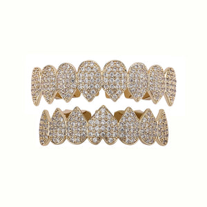 Iced Out CZ grillz teeth set in 14K gold plating for men and women, featuring top and bottom dental jewelry by Hot Trend Vault.