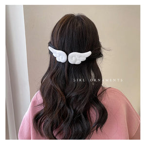 Cute plush hair clips in a 2-pack for girls and kids, featuring colorful, soft fabric with playful designs by Hot Trend Vault.