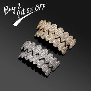Iced Out CZ grillz teeth set in 14K gold plating for men and women, featuring top and bottom dental jewelry by Hot Trend Vault.