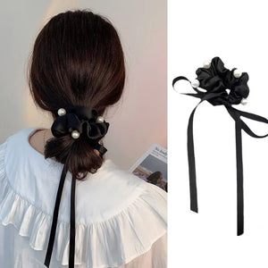 Soft velvet bow scrunchie hair tie from Hot Trend Vault, elastic hair accessory for women and girls with a stylish, gentle hold.