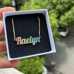 Colorful kids' name necklace set featuring gold stainless steel nameplates and bangles from Hot Trend Vault.