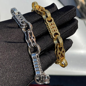 Gold plated bubble letter bracelet for men with iced out jewelry design, featuring bold, chunky letters and a shiny finish.