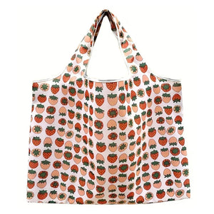 Reusable folding shopping bag by Hot Trend Vault with cartoon lemon and strawberry print, eco-friendly portable tote for shoppers.
