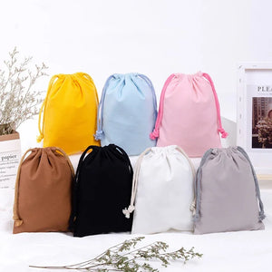 Reusable cotton produce bags with drawstrings by Hot Trend Vault, eco-friendly kitchen storage for fruits and vegetables.