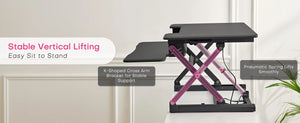 Redlife standing desk converter with integrated wireless charger, designed for office use, in a sleek black finish.
