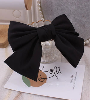 Elegant oversized satin bow barrette hair clip by Hot Trend Vault featuring a stylish knot design for women's hair accessories.