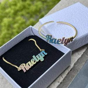 Colorful stainless steel gold nameplate bangles with a custom kid's name necklace set from Hot Trend Vault featuring vibrant design.