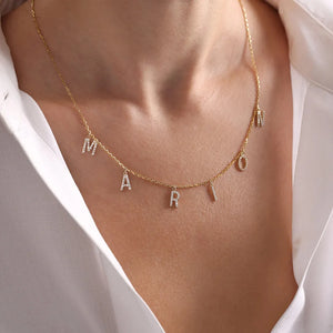 Gold stainless steel initial letter necklace by Hot Trend Vault with custom zircon name design for women