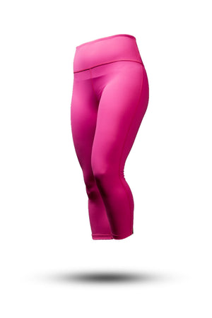 Women wearing Hot Trend Vault Women's SOHO 3/4 Leggings in Hot Shot Pink, made of premium athleisure fabric for studio and gym use.