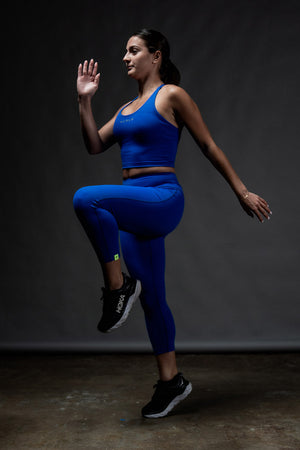 Women’s Soho 3/4 leggings by Hot Trend Vault in Neo Blue, featuring a comfortable fit suitable for studio or casual wear.