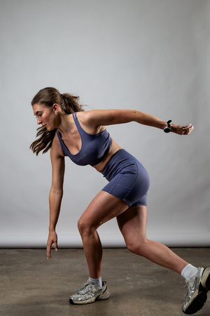 Women wearing Hot Trend Vault SOHO Cross Back Sports Bra in Lilac Mist, supportive and breathable activewear for women.