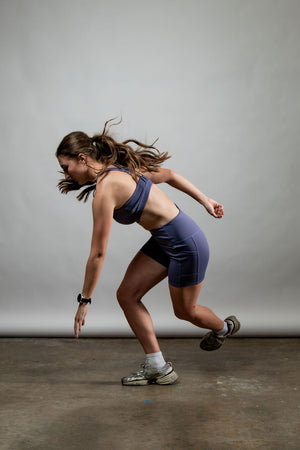 Women wearing Hot Trend Vault SOHO Cross Back Sports Bra in Lilac Mist, supportive and breathable activewear for exercise.