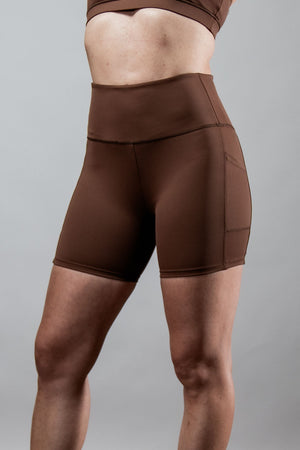 Women’s SOHO 5-inch inseam fitness shorts in City Mocha by Hot Trend Vault, shown on a model with a close-up of the shorts.