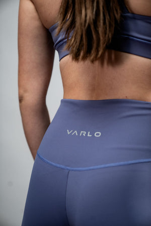 Women wearing Hot Trend Vault SOHO women's five-inch inseam fitness shorts in Lilac Mist, showing the comfortable fit and vibrant color.