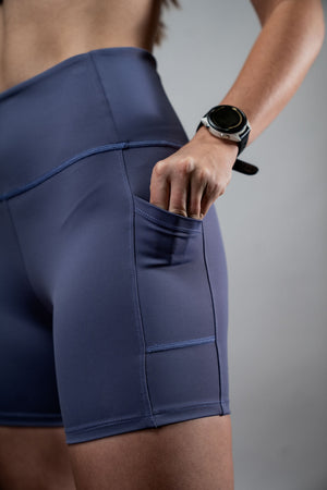 Women wearing Hot Trend Vault SOHO women's five-inch inseam fitness shorts in Lilac Mist, showing the lightweight, comfortable fabric.