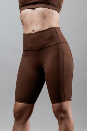 Women wearing Hot Trend Vault SOHO Fitness Shorts in City Mocha, 8-inch length, activewear for workout and active lifestyle.