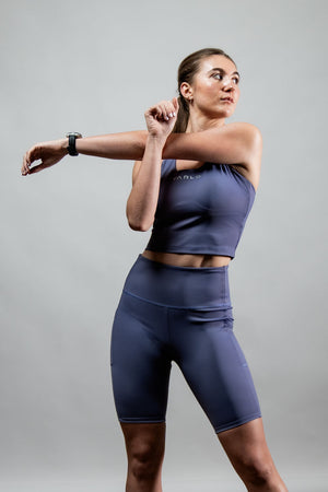 Women wearing Hot Trend Vault SOHO fitness shorts in Lilac Mist, 8-inch length, casual and comfortable for all-day wear.