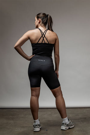 Black SOHO women's cross-back crop tank top with sleek support, featuring a stylish design and comfortable fit.