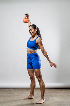 Women wearing Hot Trend Vault Soho cross-back sports bra in Neo Blue, breathable and supportive for active workouts.