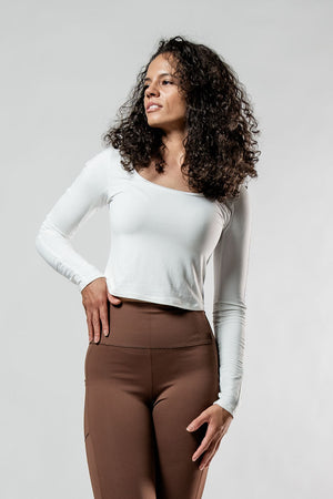 Women's Terra Recovery Arc long sleeve crop T-shirt in soft white from Hot Trend Vault, showing the fitted design and stylish neckline.
