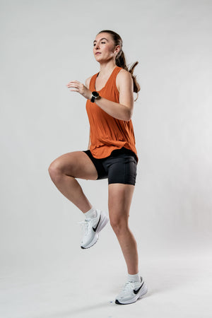 Women’s Terra Halo Recovery Tank Top in Sunfire Clay by Hot Trend Vault, breathable fabric, close-up of lightweight tank top.