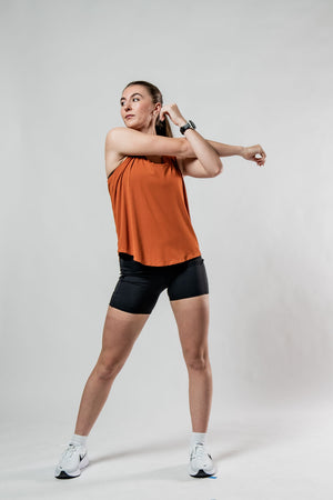 Women’s Terra Halo Recovery Tank Top in Sunfire Clay by Hot Trend Vault, featuring breathable fabric and a comfortable fit.