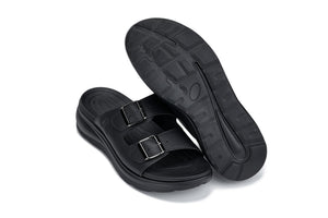 Black Calto X1660 sandals by Hot Trend Vault with dual buckles and 2 inches of added height, showcased on a neutral background.