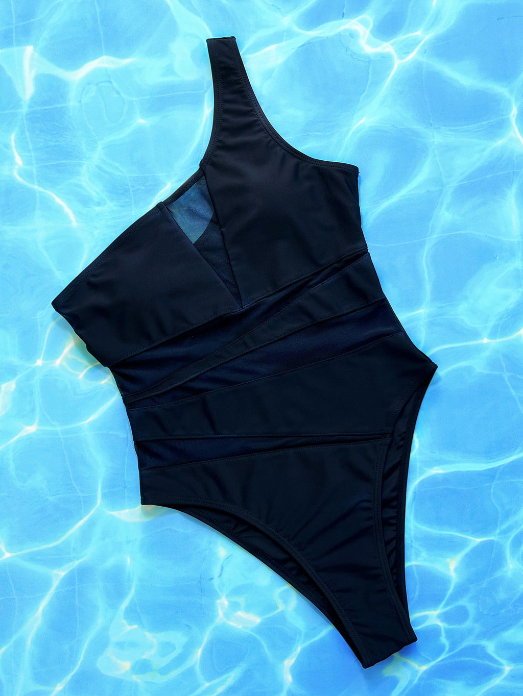 Women’s black one-piece swimsuit by Hot Trend Vault, solid color bathing suit, designed for swimming and beachwear.