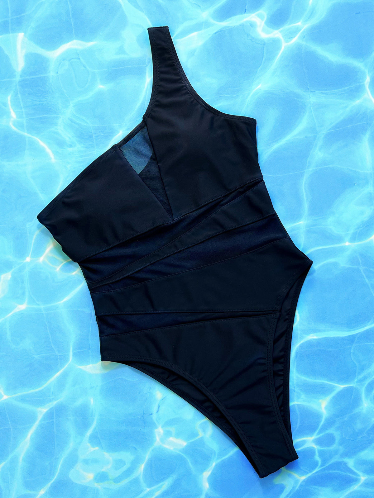 Women’s black one-piece swimsuit by Hot Trend Vault, solid color bathing suit, designed for swimming and beachwear.