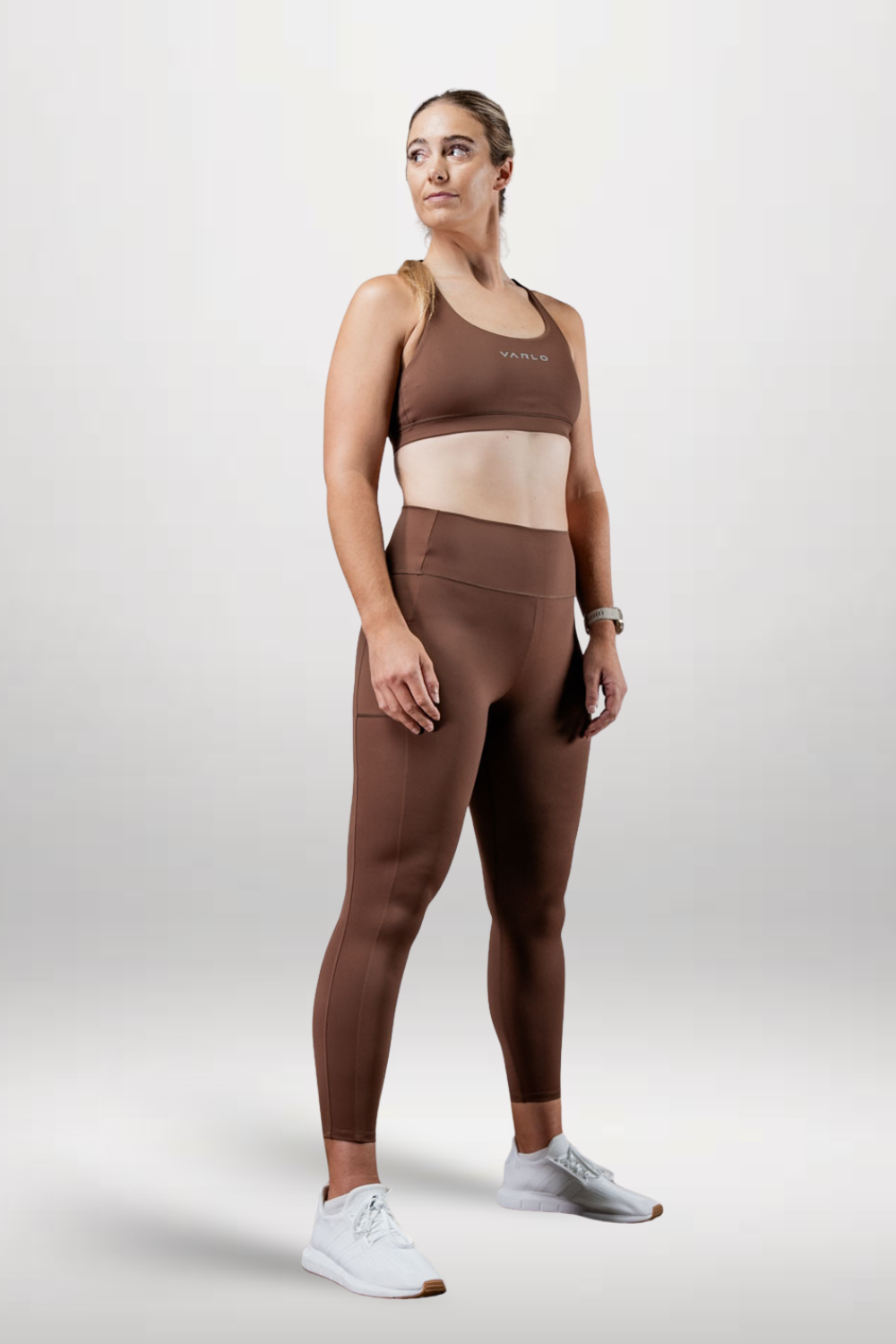 Women's Soho high waist leggings by Varlo in city mocha, full length, stretchy fabric, shown on a model.