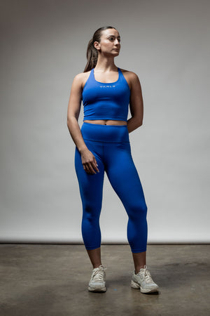 Women's Neo Blue cross back crop tank top with built-in support by Hot Trend Vault, featuring a stylish and supportive design.