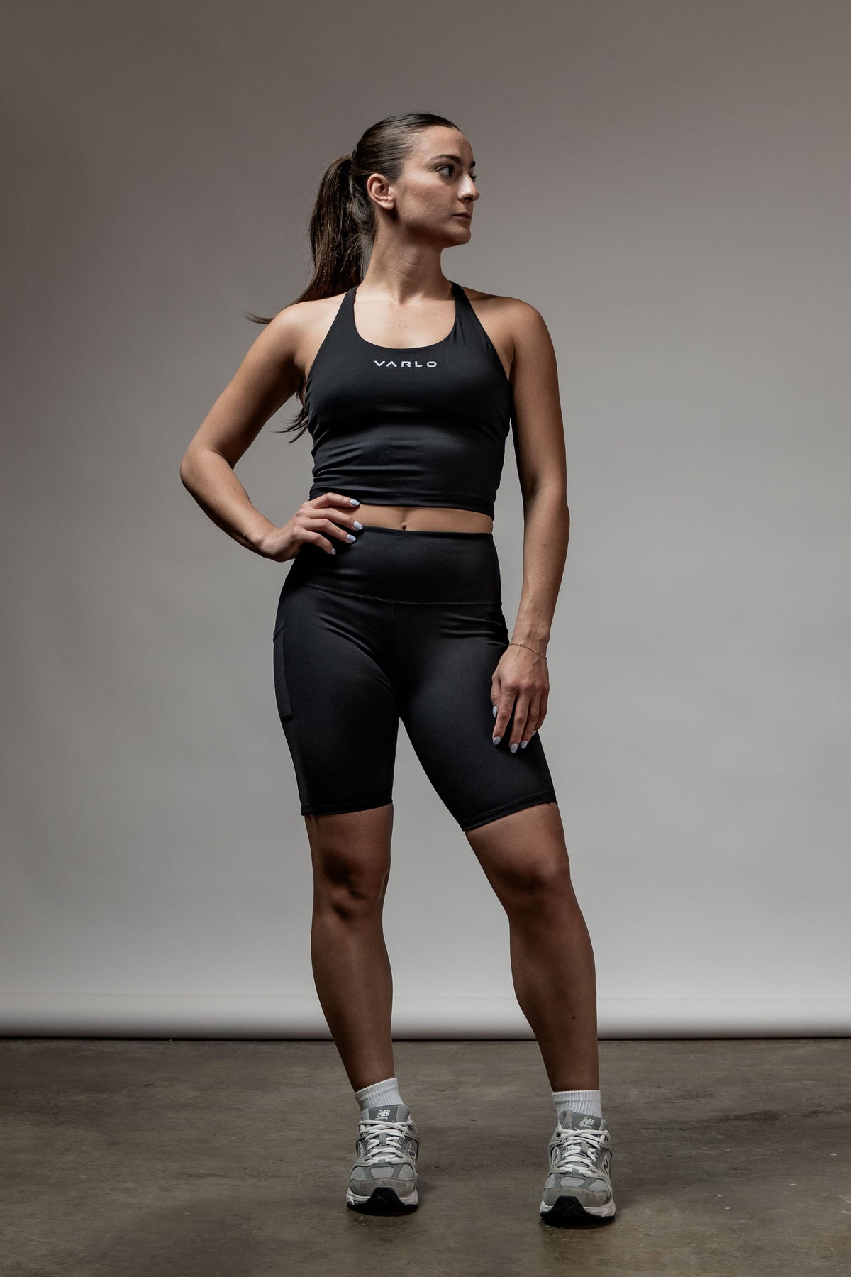 Black SOHO women's high rise technical shorts with 8-inch inseam, featuring a sleek fit and athletic design by Hot Trend Vault.