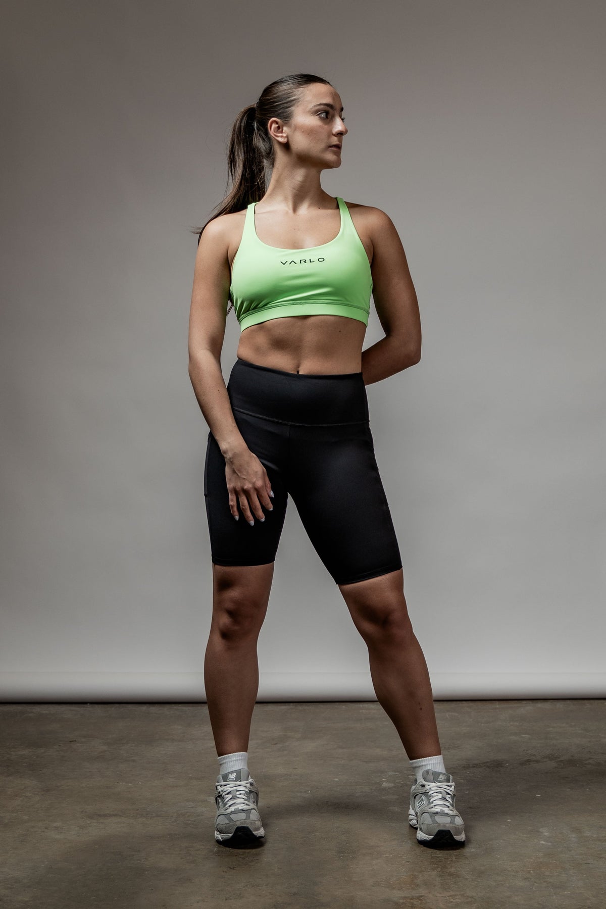 Black SOHO women's technical high rise shorts with 8-inch inseam, featuring a sleek, fitted design for active wear.