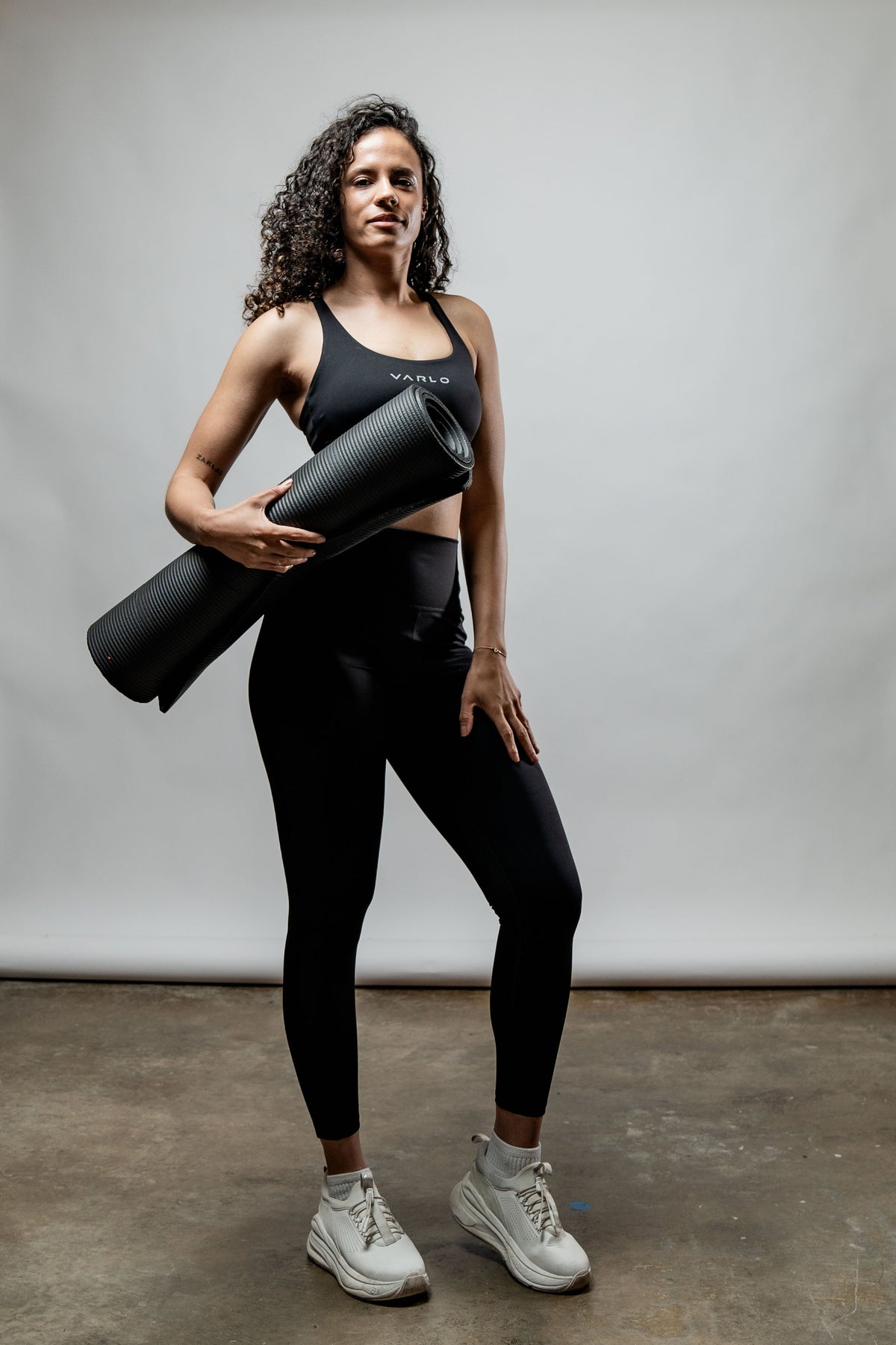 Black SOHO Cross Back Sports Bra for women by Hot Trend Vault, featuring breathable fabric and supportive design for active wear.