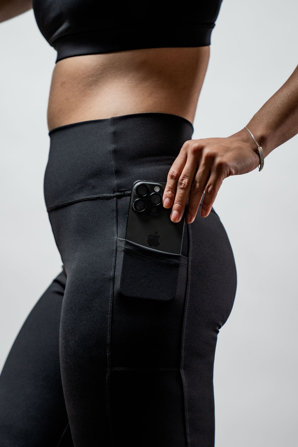 Black women's Soho full-length high waist leggings by Hot Trend Vault, showing the sleek fit and stretchy fabric.