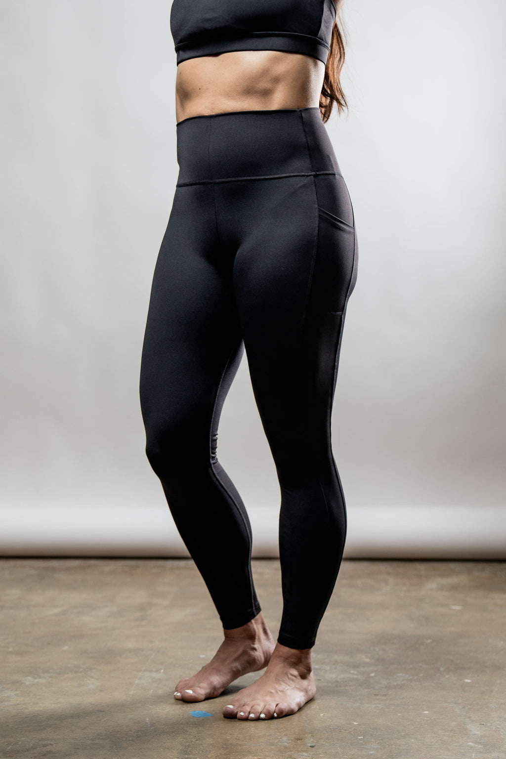 Black women's Soho full-length high waist leggings by Hot Trend Vault, shown on a model with a smooth, fitted appearance.