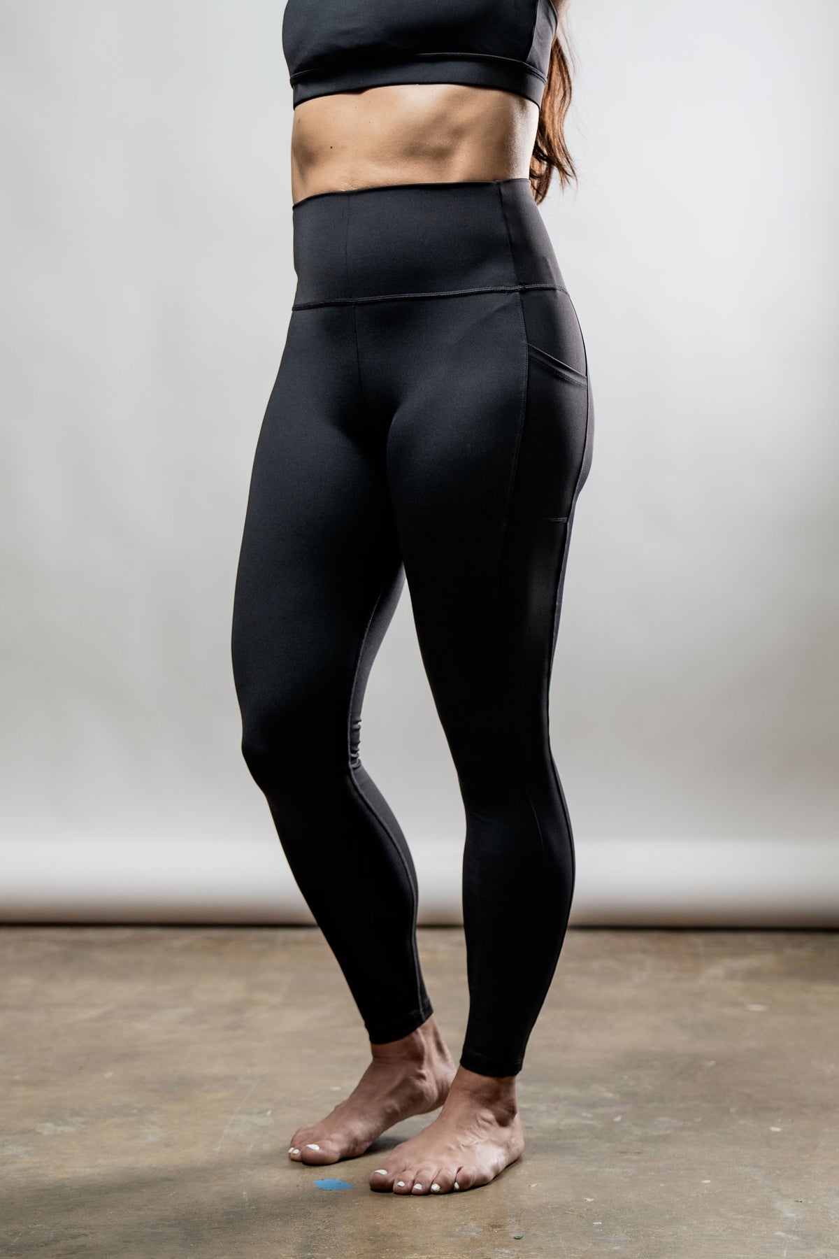 Black women's Soho full-length high waist leggings by Hot Trend Vault, shown on a model.
